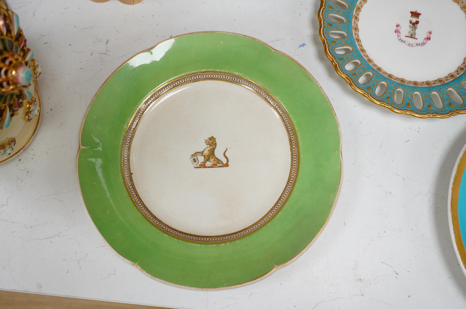 Five mixed 19th and 20th century armorial plates, including Royal Worcester, Spode and a Nelson Rockefeller collectors plate, largest 27cm diameter. Condition - two have gilded bands worn and one scratches to green glazi